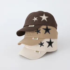 Trio of children's cotton baseball caps with star patch in brown, khaki and cream