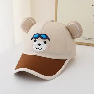 Detailed view of kids baseball cap with 3D bear ears and silicone goggle accessory
