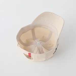 Detailed view of kids cotton baseball cap interior showing seams and sweatband
