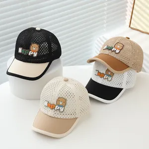 Detailed close-up of four summer mesh baseball caps for kids with cute bear patches