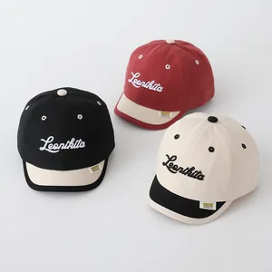 Detailed embroidery of Leonkita text on retro canvas short-brim baseball caps for kids