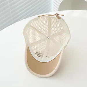 Detail of breathable mesh baseball cap with adjustable leather strap and metal buckle
