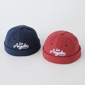 Navy and dark red kids canvas skull caps with Los Angeles embroidery and soft tops
