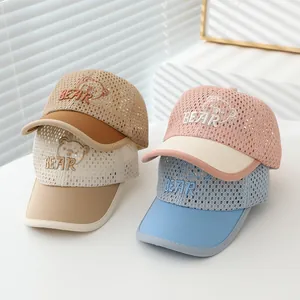 Detail of four breathable mesh baseball caps for kids with bear embroidery in assorted colors