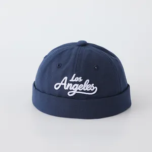 Close-up of Los Angeles white embroidery on the navy blue cotton baby docker hat