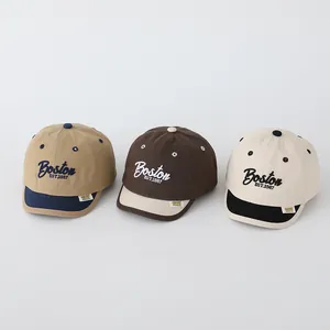 Detailed embroidery of Boston EST.1987 on vintage canvas baseball caps for kids