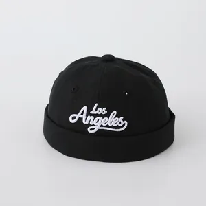 Detailed close-up of white Los Angeles embroidery on a black cotton Miki Hat for kids