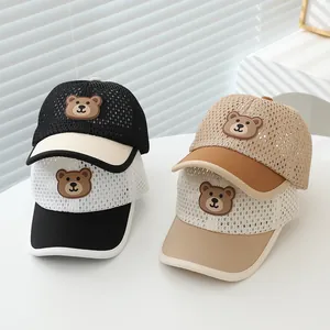 Detail view of breathable mesh kids' baseball caps with cute bear patches in four colors