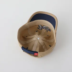 Detailed view of kids khaki baseball cap with Boston embroidery and adjustable strap