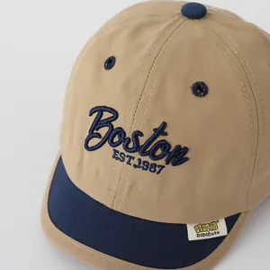 Detail view of the Boston EST.1987 3D embroidery and durable canvas texture on baby cap