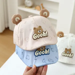 Cute cotton baby beret hats with bear ears and cartoon prints in pink, blue, and white