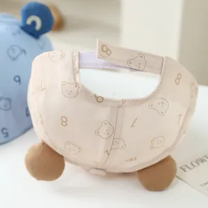 Detail of baby bear beret hat featuring adjustable velcro strap and cotton lining