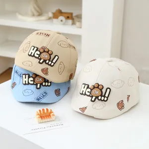Three infant cotton baseball caps featuring bear prints and 3D He OK lettering details