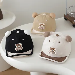 Three cotton baby baseball caps in black, beige and khaki with soft brim and 3D ears