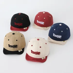 Detail view of multi-colored cotton kids' baseball caps with Brooklyn embroidery