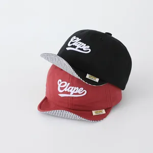 Cute soft-brim baby baseball caps in black and wine red with Clape embroidery