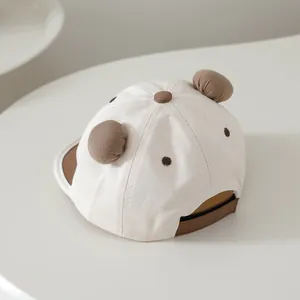 Detail of baby baseball cap with plush bear ears and adjustable brown back strap