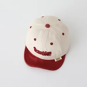 Detail of Brooklyn embroidery and soft brim on kids' two-tone cotton baseball cap