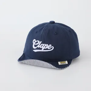 Infant soft brim baseball cap in navy blue cotton with white Clape script embroidery