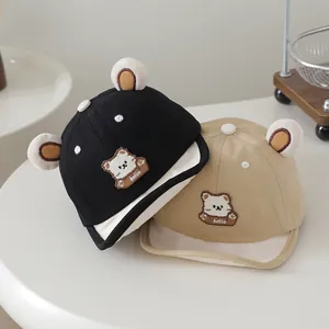 Close-up of cotton baby baseball caps with cute bear embroidery and soft 3D ears detail