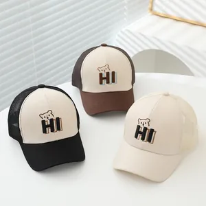 Detailed view of breathable mesh back panels and bear embroidery on baseball caps