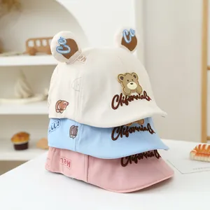 Breathable cotton baby sun hats with bear ears and embroidery in white, blue, and pink