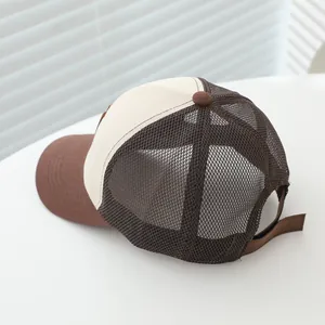 Detail of breathable brown mesh and adjustable strap on a kids trucker baseball cap