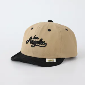 Khaki and black baby baseball cap with Los Angeles embroidery and soft brim detail