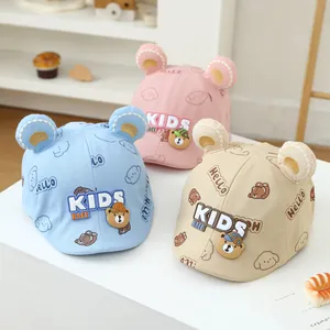 Detail of baby bear berets in pink, blue and khaki with 3D ears and Hello prints
