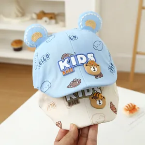 Close-up of kids baseball caps with 3D bear ears and cartoon bear embroidery patterns