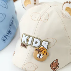 Detail of beige kids baseball cap with 3D bear ears and Kids Race graphic print