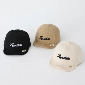 Three colors of soft-brim baby cotton baseball caps with Leonikita letter embroidery