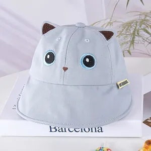 Detail of light blue baby sun hat with cute 3D cat ears and Saihabear brand label