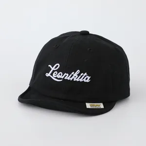 Soft cotton baby baseball cap in black with Leonikita white cursive embroidery