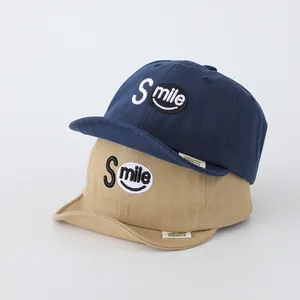 Infant cotton baseball cap with Smile embroidery in navy blue and khaki colors