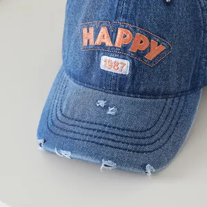 Casquette de baseball en jean délavé avec broderie HAPPY orange et bords usés vintage