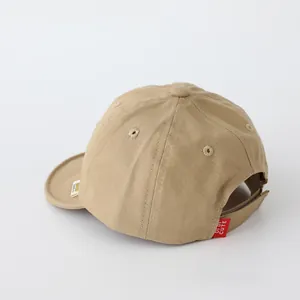 Detail view of khaki cotton baseball cap with Di Di Cute label and soft breathable fabric