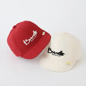 Toddler soft brim baseball cap with SMILE embroidery in red and beige cotton fabric