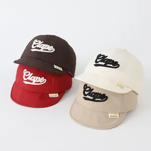 Detail showing various colors of S-letter embroidered quick-dry soft brim baby baseball caps