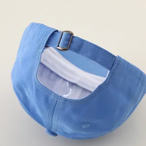 Light blue cotton baseball cap with adjustable bronze metal buckle and premium stitching