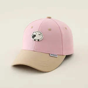 Detail of children baseball cap with sheep embroidery and pink khaki color blocking