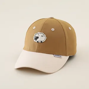 Detail view of khaki cotton baseball cap with cute sheep embroidery and white brim