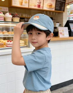 Detail of light blue quick-dry kids baseball cap with cute cat embroidery and matching t-shirt