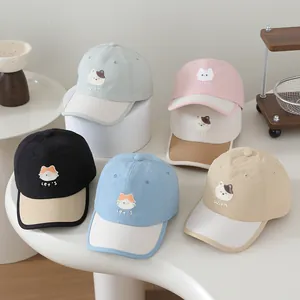 Detail showing various colors of quick-dry baseball caps with cat embroidery for kids