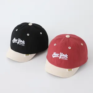 Kids New York baseball caps in black and red contrast colors with white embroidery