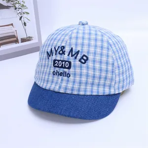 Detail of blue striped baby cap featuring custom MY & MB 2010 ohello embroidery