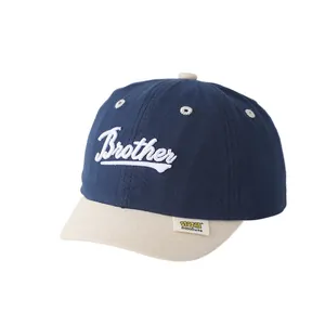 Gorra bicolor azul y beige para niños con bordado Brother y parche lateral
