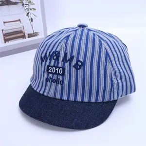 Top view of blue and white striped baby baseball cap with embroidered logo detail