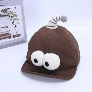 Detail of baby baseball cap featuring cartoon big eyes and soft bendable antennas