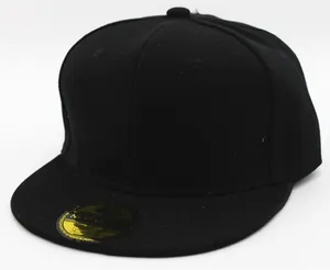 Detail shot of solid black snapback cap with premium cotton fabric and gold logo sticker